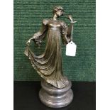 A bronze figure on marble socle - lady in flowing dress