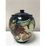 A Moorcroft ginger jar decorated with tube lined flowers