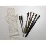 A pair of Victorian lady's calf skin leather gloves, two pairs of glove stretchers,