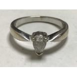 An 18ct white gold pear cut diamond ring