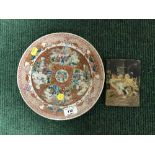 A Chinese cabinet plate and a hand painted wooden panel depicting Persian figures