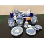 A collection of twenty one pieces of Wedgwood blue and white Jasperware comprising three vases,