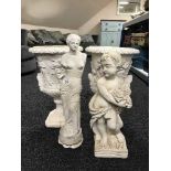 A pair of classical style garden urns,