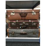 Three vintage suitcases