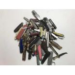 A collection of approximately 80 penknives,