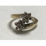 A 9ct gold diamond double cluster ring, approximately 0.5ct.