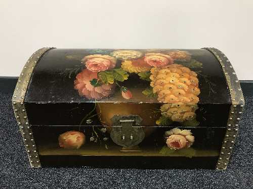A painted dome topped trunk and four rolls of wall paper