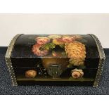 A painted dome topped trunk and four rolls of wall paper