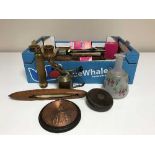 A box of ornaments, books, brass blow torch,