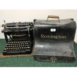 An antique Remington typewriter in metal carry case