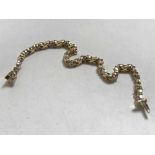 An 18ct gold bracelet set with thirty-six diamonds approximately 1ct, 14.95g.