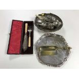 A tray of plated tray, cutlery, swing handled basket,