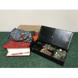 A box of costume jewellery, beaded purse,