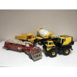 A collection of toy trucks, Tonka crane,
