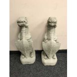 A pair of garden figures - gargoyles bearing shields