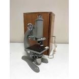 A 20th century microscope in mahogany box