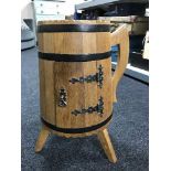 An oak barrel storage cupboard modelled as a flagon