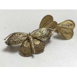 A silver gilt butterfly brooch together with pair of matching earrings stamped 9ct.