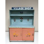 A mid 20th century wooden village shop