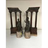 A pair of bronze classical style statues on marble bases and a pair of mahogany ormolu mounted