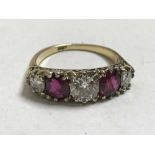 A fine 18ct gold ruby and diamond ring, the central stone approximately 1.1ct.