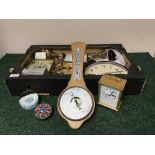 A box of clocks, carriage clocks, two glass paperweights,