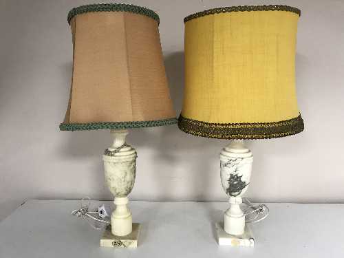 A pair of marble table lamps with shades