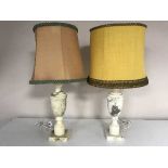 A pair of marble table lamps with shades