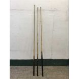 Three snooker cues