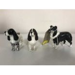 A Beswick sheepdog and two spaniels