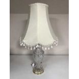 A lead crystal table lamp with shade