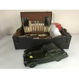 A box of oak canteen of cutlery, Dartmouth pottery china car, place mats, napkin rings,