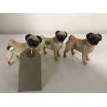 Three small Beswick figures - pugs