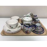 A tray of French Luneville cups and saucers, oriental china tea for two,