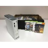 A box of Xbox 360 with leads and games