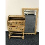A continental oak two drawer chest and matching wall mirror
