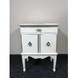 A painted pine tiled topped cabinet