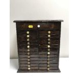 An antique mahogany multi drawer miniature collector's chest