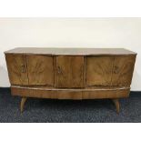 A mid 20th century cocktail cabinet and drop leaf table