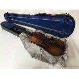 An early twentieth century violin, labelled within 'Manufactured in Dresden,