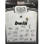 A framed Real Madrid signed football shirt with Bwin.