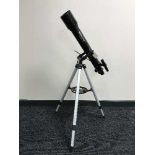 A Celestron Power Seeker 70AZ telescope on stand