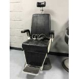 A mid 20th century electric hydraulic chair