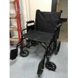 A folding lightweight wheel chair