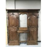 An antique oak panelled hall stand