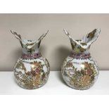 A pair of white decorative oriental style vases