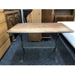 A rectangular metal based pub table