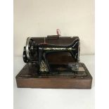 A mahogany cased Singer hand sewing machine