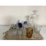 A tray of two glass decanters with stoppers, assorted drinking glasses, tankard,