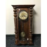 An Edwardian mahogany wall clock